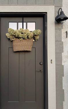 a door with a planter hanging on it's side