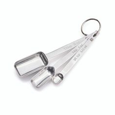 three measuring spoons are sitting on top of each other