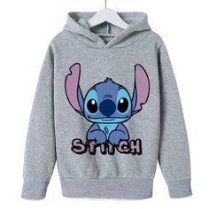 This Stylish Animated Printed Fun Hoodie, featuring a vivid character design, is tailored for active kids who like vibrant attire. With a warm lining and a classic hood, it's perfect for keeping comfortable during lively play or everyday wear. Ribbed cuffs and hem provide a secure fit, while the durable fabric ensures long-lasting resilience. Specifications: Material: Soft, warm, and durable fabric. Special Features: Character design with a vivid, playful motif. Technical Specifications: Contras Lilo And Stitch Hoodie, Lilo Und Stitch, Stitch Sweatshirt, Stitch Hoodie, Lilo Y Stitch, Lilo Et Stitch, Stitch Clothes, Disney Hoodies, Cute Stitch