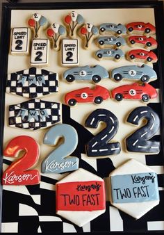 the cookies are decorated with cars and numbers for two fast birthday party guests to eat