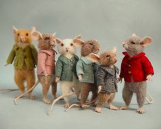 a group of mice dressed in coats and jackets