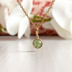 31.00 GBP This beautifully simple necklace is lovingly handmade with a tiny Peridot gemstone and a choice of 14k Gold Filled, 14k Rose Gold Filled or Sterling Silver ​Chain. M A T E R I A L S: • Peridot • 9ct Gold, 14k Gold Filled, 14k Rose Gold Filled or Sterling Silver Chain S I Z E: • Gemstones - Approximately 4mm • Chain Thickness - Approximately 1.1mm All of our jewellery is carefully handmade using good quality materials and handpicked gemstones, with the aim to produce quality… 14k Gold Wire Wrapped Necklace As Gift, 14k Gold Wire Wrapped Necklace For Gift, Yellow Gold Dainty Necklace For May Birthstone, Dainty May Birthstone Gemstone Necklaces, Recycled Gold Gemstone Birthstone Necklace As A Gift, Recycled Gold Birthstone Gemstone Necklace For Gift, Recycled Gold Birthstone Necklace As Gift, Recycled Gold Birthstone Necklace Gift, Dainty Handmade Birthstone Pendant Necklace