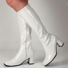 Step up your style game with these White Patent Leather Fashion Below-The-Knee Heeled Boots. Perfect for women who want to make a bold statement with every step they take. Color: White Material: Patent leather Heel Type: Chunky heel Heel height: 2.36" / 60 mm approx Product measurements were taken using size 8. Please note that measurements may vary by size. Toe: Square toe Half-length zipper design makes it easier to wear on Handcrafted US sizing. Fits true to size. 20s Shoes, White Gogo Boots, Disco Shoes, 70s Boots, Retro Boots, Heel Boots For Women, Hippie Top, Gogo Boots, Chunky Heels Boots