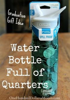 a water bottle full of quarters sitting on a table with the words graduation gift idea