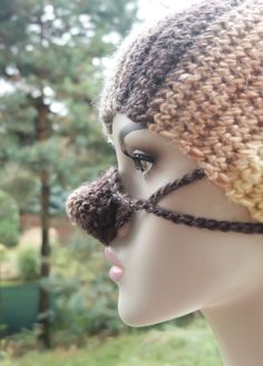 a mannequin head wearing a crocheted hat