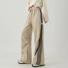 Baggy Wide Leg Sportswear Bottoms, Wide Leg Sportswear Bottoms, Sporty Spring Pants, Beige Wide Leg Sweatpants For Streetwear, Beige Wide-leg Sweatpants For Streetwear, Spring Sportswear Trousers, Spring Sports Straight Pants, Spring Sports Straight Bottoms, Trendy Wide Leg Sports Bottoms