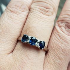 This wonderful natural blue sapphire ring is just a stunner. The ring is set in 14K White Gold and set with 3 natural blue sapphires and spaced with natural diamonds. Royalty often wore sapphires for dual purposes. Not only did the stone reputedly attract wealth, it also purportedly protected the wearer from envy and infidelity. Traditionally, people attributed to this gem the power to bring harmony between lovers as well as peace between adversaries. This ring comes with an independent appraisa 3 Stone Sapphire Ring, Blue Sapphire Three Stone Ring With Diamonds, Fine Jewelry Three-stone Sapphire Ring, Sapphire Three Stone Diamond Ring For Anniversary, Fine Jewelry Blue Diamond Ring With Three Stones, Sapphire Three Stone Diamond Anniversary Ring, Anniversary Sapphire Three-stone Diamond Ring, Blue Three Stone Sapphire Ring, Anniversary Sapphire Three Stone Diamond Ring