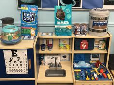 the children's play area has toys and games on it, including an eye chart