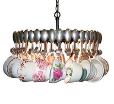 a chandelier with tea cups hanging from it