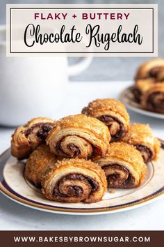 chocolate roll on a plate with coffee in the background and text overlay reading flaky + buttery chocolate rugelah