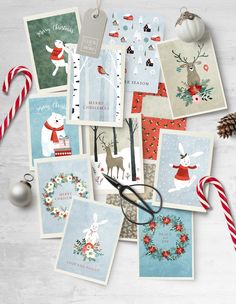 various christmas cards with scissors and candy canes