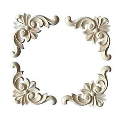 an ornate frame made out of wood with swirls and leaves on the edges, in white