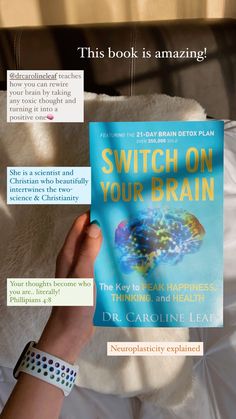 a person holding up a book on their left hand and the words switch on your brain above it