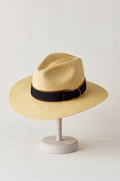 Wherever you're going, you'll be noticed and protected in the Chateau Fedora hat. Hand woven of lightweight, bleached straw from Ecuador, this dashing hat keeps you cool, ventilated, and shaded from the sun with its 3" downturn brim. The pinch-front crown is accented with a grosgrain ribbon finished with a bow, and the interior sweatband lends a soft, stretchy feel to everyday wear. Beige Panama Hat With Curved Brim For Travel, Natural Fedora With Curved Brim In Toquilla Straw, Beige Curved Brim Straw Hat For Outdoor Use, Natural Toquilla Straw Fedora With Curved Brim, Beige Straw Panama Hat With Curved Brim, Straw Panama Hat With Curved Brim, Summer Travel Straw Hat Made Of Toquilla, Summer Travel Straw Hat In Toquilla, Summer Travel Straw Hat Made From Toquilla