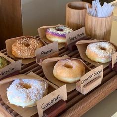 there are many different types of donuts on display