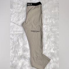 Women’s Leggings Essentials Fear Of God Size: Small Nwt Fitted Beige Pants For Streetwear, Fitted Beige Pants For Everyday, Everyday Fitted Beige Bottoms, Casual Beige Leggings For Loungewear, Sporty Neutral Bottoms For Spring, Essentials Pants, Essentials Fear Of God, Ribbed Leggings, Cotton Leggings