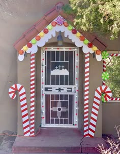 an entrance to a church decorated with candy canes