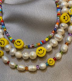 This beaded pearl necklace is perfect for brightening up any outfit! Dress it up for a more elegant night out, or wear it casually for a chic, beachy look. Perfect for the summer months or a touch of fun during an overcast winter day. This necklace is made out of freshwater pearls and 10mm yellow happy face beads, finished with silver hardware. Necklace Length: 14.5 inches - We add a 2in extender chain at the end to make the necklace adjustable (14.5 inches - 16.5 inches) - If you would like a d Beaded Pearl Necklace, Pearl Beaded Necklace, Summer Necklace, Necklace Pearl, Outfit Dress, Necklace Beaded, Seed Bead Jewelry, Happy Face, Beaded Choker