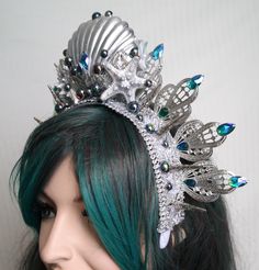 Mermaid headpiece, Blue green mermaid crown This spectacular, shiny mermaid crown is made with glittery gorgeous filigreegold leaves, lace, crystals and beads. This piece is glitters and sparkles with every move. Elegant and regal, this headdress is ideal for making a statement. With so many reflective elements, it is ideal for stage. It can be a great addition to any mermaid costume - Ocean Queen, Sea Queen, Sea goddess. A beautiful and sparkly headdress that is lightweight, comfortable to wear Princess Style Headpiece With Teardrop Crown For Parties, Fantasy Crown With Pinched Crown For Party, Fantasy Crown With Pinched Shape For Party, Fantasy Crown With Round Crown For Party, Fantasy Crown For Party, Fantasy Teardrop Crown For Costume Party, Fantasy Teardrop Crown For Party, Whimsical Teardrop Crown For Parties, Mystical Crown Costume Hats And Headpieces For Party