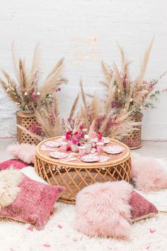 the table is decorated with pink and gold decorations