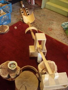 a group of wood pieces sitting on top of a red rug