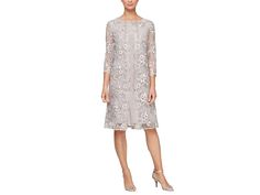 Alex Evenings Short Embroidered Mock Dress with Illusion Sleeves - Women's Dress : Taupe : Discover a new style for your nightlife with the Alex Evenings Short Embroidered Mock Dress. Embrace sophistication in this lace-embellished beauty, featuring illusion sleeves and a solid sheath dress underneath. The scallop detail adds a touch of charm, while the scoop neck and 3/4 sleeves enhance the silhouette. Zip up for a seamless closure, and radiate timeless style. 96% polyester, 4% spandex. Dry-clean only. Imported. Spring Evening Mini Dress With Illusion Neckline, Knee-length Mini Dress With Sheer Sleeves For Evening, Fitted Mini Dress With Illusion Neckline, Cocktail Knee-length Dress With Illusion Neckline, Luxury Embroidered Short-sleeve Dress, Mock Dress, Illusion Sleeves, Alex Evenings, Sleeves (women)