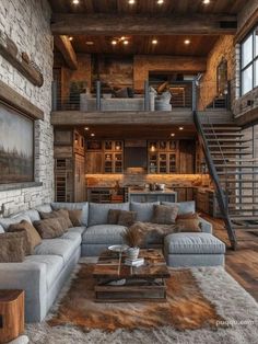 a living room filled with lots of furniture next to a stair case in a building