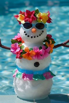 a snowman made out of fake flowers in the pool