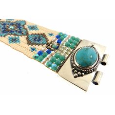 Chili Rose Beaded Turquoise & Gemstone Bracelet by Adonnah Langer of Santa Fe, New Mexico Gorgeous Diana Bracelet features a Southwestern blend of turquoise, olive green and red Swarovski beads handcrafted with a true artistic mix of beads and a canvas of gorgeous colors. Gorgeous Turquoise Oval Medallions Grace the ends of this woven beaded bracelet *Measures 6 3/4 inches to 7 1/2 inches- please specify (made to order) *Medallion measures 1 1/4 inch x 7/8 inch *Sterling Silver .925 *Hidden Lock Artisan Turquoise Bracelets For Gift, Handmade Southwestern Green Beaded Bracelets, Handmade Artisan Turquoise Bracelets, Handmade Green Southwestern Beaded Bracelets, Southwestern Natural Stones Beaded Bracelets For Festivals, Southwestern Natural Stone Beaded Bracelets For Festivals, Artisan Turquoise Beaded Bracelets Adjustable, Adjustable Turquoise Beaded Artisan Bracelets, Artisan Turquoise Beaded Bracelets For Gifts