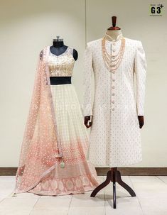 two mannequins dressed in white and pink outfits