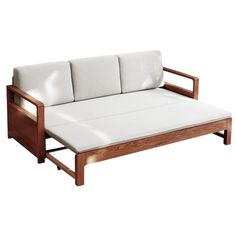 a white couch sitting on top of a wooden frame