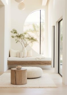 a living room filled with furniture and a large window