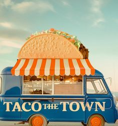 a taco truck parked in front of a building