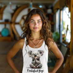 Koala clothes for yoga - yoga clothes for women Introducing the ultimate blend of comfort, style, and serenity: our Koala Yoga Tank Top for women is designed to give your yoga experience a dash of adorable flair. Crafted with the softest materials and featuring a cute print of a serene koala indulging in yoga meditation, this tank is a testament to your journey towards inner peace. Embrace your inner "koalafied yogi" as you gracefully flow through your practice. Our tank top boasts a flattering racerback design, ensuring optimal movement and breathability throughout your yoga session. The lightweight fabric gently hugs your curves, while raw edge seams add a touch of edgy charm to your ensemble. Made from a premium blend of 50% polyester, 25% combed ring-spun cotton, and 25% rayon, our tan Comfortable Casual Activewear For Yoga, Comfortable Activewear For Yoga, Comfortable Casual Yoga Pants, Fitted Tank Top For Yoga, Casual Sleeveless Activewear For Relaxation, Summer Meditation Yoga Pants, Summer Yoga Activewear With Relaxed Fit, Summer Yoga Activewear In Relaxed Fit, Cotton Relaxed Fit Activewear For Yoga