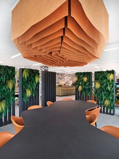 an office meeting room with plants on the walls