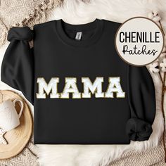 This Mama Sweatshirt, adorned with a glittering Chenille Patch and Varsity lettering, is the ultimate Mama gift, perfect for celebrating Mother's Day, birthdays, or baby showers. Elevate mom's style with this unique and thoughtful sweatshirt featuring sparkling Chenille letters, making it a dazzling and meaningful addition to her wardrobe. 🌟 Colors may appear slightly different in person versus on the computer screen and our photos all show natural lighting.     🌟 The patches are heat pressed on and all designs are hand placed, therefore there may be a slight difference in positioning of the design than the ones pictured. Patches are approximately 8cm in size (height). 🌟 We offer several sweatshirt colors and 1 patch color. For other patch colors, check out our other listings: Light Pin Mama Chenille Sweatshirt, Gold Tops With Letter Print For Gifts, Mama Crewneck, Pink Patch, Chenille Patch, Cadeau Baby Shower, Mom Sweater, Bunny Designs, Mama Gifts