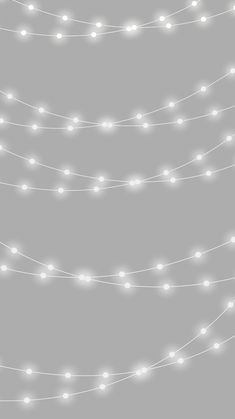 a string of white lights on a gray background