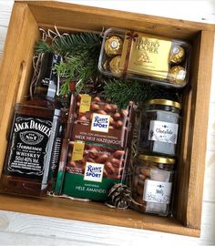 a wooden box filled with lots of different types of food and condiments in it