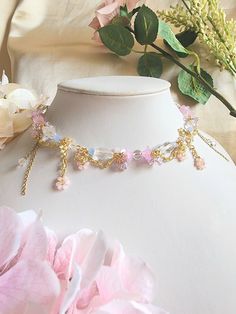 Elevate your look with the breathtaking Floral Pools Necklace. This elegant piece is inspired by the enchanting image of flowers floating on shimmering water. Crafted with a base of faceted glass beads, pastel flowers beads and crystal beads, the necklace will add a dreamy touch to your look. 🌸Handcrafted with glass beads, acrylic beads, glass seed beads and gold-plated findings. 🌸All variations come with a 5cm extender. Shimmering Water, Flower Beaded Necklace, Beaded Flower Necklace, Necklace Fairy, Flowers Beads, Fairy Jewelry, Jewelry Birthday, Pastel Flowers, Necklace Beaded