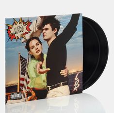 an album cover with the image of a man and woman pointing at something in front of them