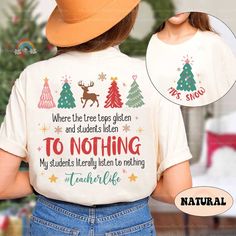 Teacher Christmas Shirt Tree Tops Glisten and Children Listen to Nothing, Funny Teacher Xmas Shirt, Teacher Holiday, Teacher Christmas Gifts ↓ Click here to view our additional fashionable collections ↓ https://handcraftedbyhelenn.etsy.com Product Details: - 100% Cotton (fiber content may vary for different colors) - Medium fabric (5.3 oz/yd2 (180 g/m2)) - Classic fit - Tear away label - Runs true to size Care instructions: - Machine wash: warm (max 40C or 105F); - Non-chlorine: bleach as needed; - Tumble dry: Medium - Do not iron; Do not dry clean ● Please choose your preferred style, size, and color from the dropdown menu or leave us a message in the "notes to seller" section. ● We are committed to processing and shipping your items as quickly as possible, but please note that custom pri Cute Teacher Christmas Shirts, Christmas Teacher Gift, Funny Teacher, Xmas Shirts, Teacher Christmas Gifts, Holiday Shirt, Teacher Christmas, Tree Tops, Teacher Humor