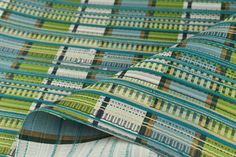 the fabric is green and blue with stripes