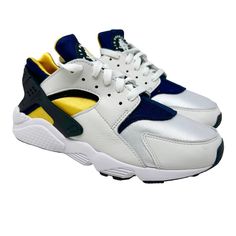 Nike Air Huarache Michigan Dd1068-107 White /Varsity Maize/Blue Retro Sizes 8-11 University Of Michigan And The Air Huaraches Are Better Known For Changing The Game With The Fab 5, But On This Navy + Maize Low Top Edition, The University's Colors Hit The Og Version Of The Nike Air Huarache. With White Leather Overlay, The Navy And Yellow Bootie Sock Ensures A Snug Fit. A Classic White Midsole Hits The Model That Has Been In Demand For Decades. Style Code: Dd1068-107 Color: White /Varsity Maize/B Sporty White Lace-up Huaraches, Urban White Custom Sneakers With Vibram Sole, White Urban Custom Sneakers With Vibram Sole, White Sports Huaraches With Round Toe, White Sport Huaraches With Round Toe, White Urban Sneakers With Vibram Sole, White Sporty Huaraches With Round Toe, Sporty White Huaraches With Round Toe, White Huaraches For Sports With Round Toe