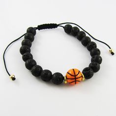 Adjustable Beaded bracelet with acrylic basketball and black lava beads      Bracelet Inner Diameter 55mm to 93mm Casual Adjustable Lava Stone Beaded Bracelets, Adjustable Lava Stone Beaded Bracelets, Casual Adjustable Lava Stone Jewelry, Casual Round Beads Bracelets For Sports Events, Adjustable Black Jewelry For Sports, Black Sports Jewelry With Round Beads, Adjustable Black Wristband For Sports Events, Casual Black Lava Stone Beaded Bracelets, Casual Black Beaded Lava Stone Bracelets