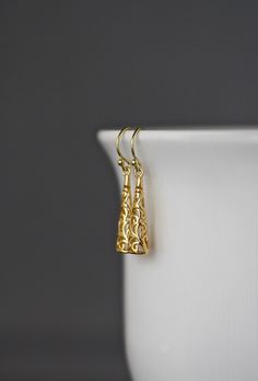 "Beautifully detailed 14k shiny gold vermeil filigree long drop charms simply dangle from 18k gold vermeil balled earwires. These incredibly lightweight go-with-everything earrings complete any outfit for daytime or evening. Gold charms: 6x25mm Total length of earrings: almost 1 1/2\" These earrings are also available in silver... www.etsy.com/listing/601324485/silver-filigree-earrings As the owner, maker, designer, and curator of this shop, I take great pride in providing you with jewelry that Gold Filigree Sterling Silver Chandelier Earrings, Gold Sterling Silver Filigree Chandelier Earrings, Yellow Gold Dangle Plug Earrings For Formal Events, Formal Brass Plug Earrings, Gold Plug Earrings For Wedding With Pierced Ears, Gold Plug Earrings For Weddings, Formal Brass Dangle Plug Earrings, Yellow Gold Plated Filigree Chandelier Earrings, Yellow Gold Plated Chandelier Earrings With Filigree