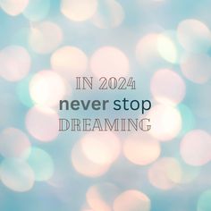 a blurry background with the words in 2020 never stop dreaming