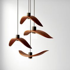 three wooden wind chimes hanging from the ceiling