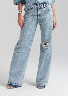 Dazzle in denim with our Bronte Wide Leg Jean. This on-trend silhouette in acid wash denim features light distressing at the knee and all-over crystal embellishments. Wear it with our matching Doreen Denim Shirt for a sexy take on the Canadian tuxedo. Shown here in Arctic Crystal. 100% Cotton Made in India Model is 510 Denim And Rhinestone Outfit, Denim And Diamonds Outfit, Bedazzled Jeans, Plus Size Workwear, Australia Clothes, Canadian Tuxedo, Denim And Diamonds, Womens Denim, Embellished Denim