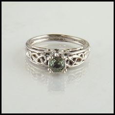 Celtic Cathedral Ring in White Gold with Green Sapphire Wedding Rings Sage Green, Sage Wedding Ring, Silver And Green Wedding Ring, Green Wedding Ring Silver, Irish Engagement Rings Celtic Wedding Bands, Unconventional Wedding Rings Silver, Celtic Engagement Ring, Nontraditional Engagement Rings Silver, Sage Green Wedding Ring