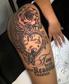 a woman's leg with a tattoo on it and an image of a clock